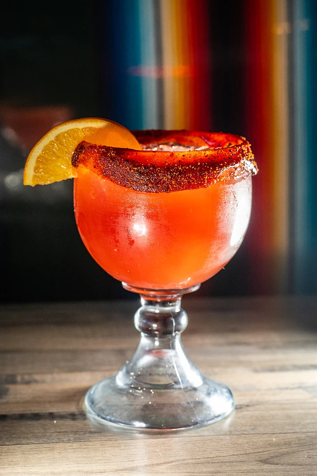 Strawberry margarita with a chile-salt rim