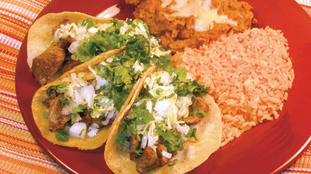 Plate of tacos, beans, and rice